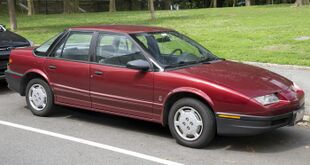 1995 Saturn SL1 maroon, front right.jpg