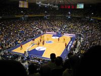 An indoor arena filled with people.