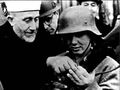 Palestine's Mufti al-Husseini inspects weapons with the Nazis.jpg