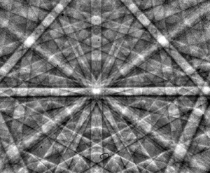 An electron backscatter diffraction pattern of monocrystalline silicon, taken at 20 kV with a field-emission electron source. The Kikuchi bands intersect at the centre of the image