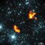 False-colour image showing Alcyoneus with LOFAR radio data at 144 MHz (orange) and WISE infrared data at 3.4 micron (blue) overlaid.