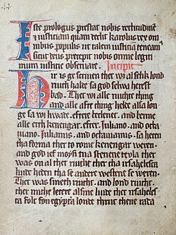 An old manuscript with thick blackletter font with some blue- and red-colored writing in some spots