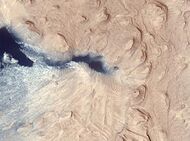 Crommelin Crater Layered Deposit, as seen by HiRISE. The color blue in the photo is a false color.