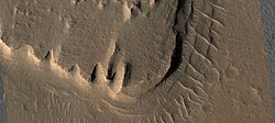Close view of layered mesa with pyramid shapes, as seen by HiRISE under HiWish program. This is part of an image that was named HiRISE Picture of the day.