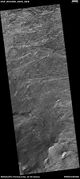Wide view of layers in Crommelin crater, as seen by HiRISE under HiWish program Parts of this photo are enlarged in following images.