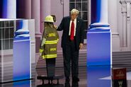 Donald Trump, who survived an attempted assassination in Pennsylvania in July 2024. This image shows Donald Trump paying respect to Corey Comperatore's firefighter uniform; he lost his life in the assassination attempt.