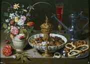 Still life Mesa ("Table") with dried figs and other fruits in a bowl by Clara Peeters, 1611