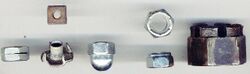 Left to right: Slotted, square (upper), T-nut (lower), cap (or acorn), nylon locking (top and side views), and castellated nuts.