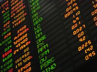 Looking up at a computerized stocks-value board at the Philippine Stock Exchange