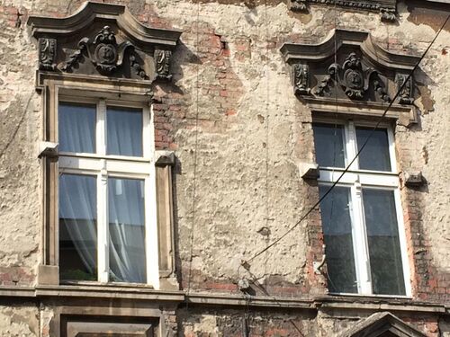 Pediment detail with the "K" initial