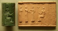 Sumerian cylinder seal and impression, dated c. 2100 BC, of Ḫašḫamer, ensi (governor) of Iškun-Sin c. 2100 BC. The seated figure is probably king Ur-Nammu, bestowing the governorship on Ḫašḫamer, who is led before him by Lamma (protective goddess).[304]