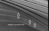 Close view of layers in northern ice cap, as seen by HiRISE under HiWish program Arrows point to an angular unconformity.