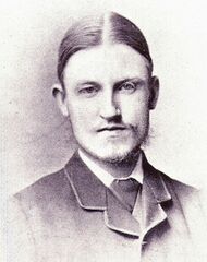 young man with faint, wispy beard