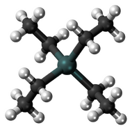 A gray-green sphere linked to four black spheres, each, in turn, linked also to three white ones