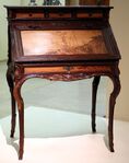 Desk (Art Nouveau), presented at the 1900 Paris Exposition; by Émile Gallé; 1900; molded and carved oak, with chiseled and patinated bronze; height: 108.5 cm; Musée d'Orsay (Paris)[64]