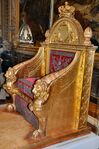 Empire throne; by Bernard Poyet and François-Honoré-Georges Jacob-Desmalter; 1805; carved and gilded wood, covered in red velvet with silver embroidery; 160 x 110 x 82 cm; Musée des Arts Décoratifs[61]