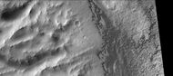 Part of Dawes Crater showing eroding wall on left and dunes on crater floor on the right. Picture taken with CTX camera (on Mars Reconnaissance Orbiter).