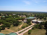 Aerial photograph of a university in Bulawayo, Zimbabwe surrounded by many trees.