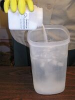 Lye being dissolved in water for soapmaking