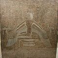Relief of a woman kneeling on a stool and spreading her arms, to which wings are attached