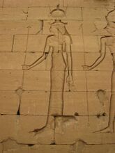 Relief of a woman in Egyptian clothing with an elaborate headdress