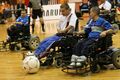 Powerchair football, also called "power soccer", uses an attachment over the footrest of a power wheelchair to bump or push the ball.