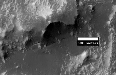 Claritas Fossae as seen by HiRISE. Note the steep scarp.