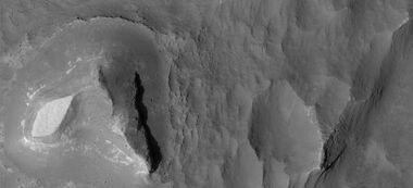 Light-toned butte on floor of Noctis Labyrinthus, as seen by HiRISE under HiWish program. Note: this is an enlargement of a previous image.