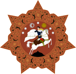 A round orange badge with six points and a horse-mounted man in the centre