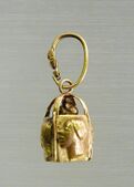 Earring from a pair, each with four relief faces; late fourth–3rd century BC; gold; overall: 3.5 x 0.6 cm; Metropolitan Museum of Art