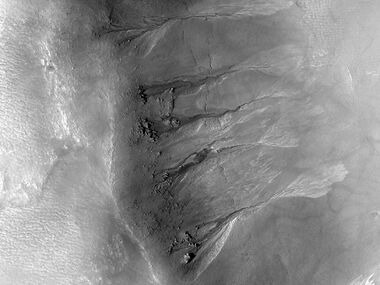 Gullies on crater wall The bright apron is a bit unusual.