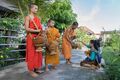 Buddhist monks in Laos collecting alms