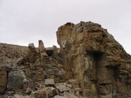 Markus Landgraf of Crew 7 uses a geologist hammer to obtain rock samples during EVA.
