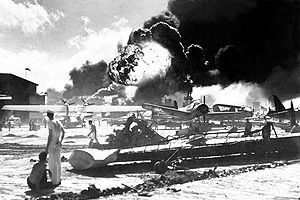 Captured Japanese photograph taken during the attack on Pearl Harbor, December 7, 1941. In the distance, the smoke rises from Hickam Field. (Navy)