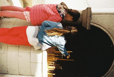 Girls lighting Candles at Monastery of Saint Johns