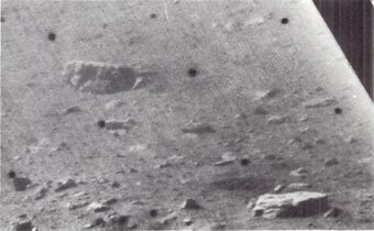 Blocky fragments on north wall of crater in which the spacecraft is located
