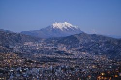 View of La Paz from El Alto with the Illimani mountain in the background.