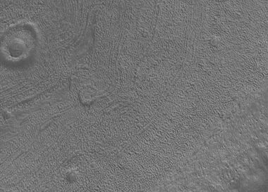 Close up image of Phaethontis surface taken with Mars Global Surveyor. Holes are thought to be caused by buried ice turning into a gas.