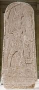 Baal with Thunderbolt (c. 14th century BC), an Ugaritic stele from Syria