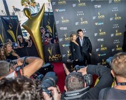 Lara Bingle and Sam Worthington on 2014 AACTAS Awards red carpet (1).jpg