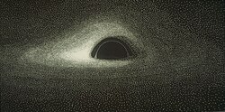 A black and white image of a black hole with an accretion disk on punch cards. The black hole is visible as a black semicircle in the center with a white ring overlaid. Around it, a bright white accretion disk wraps around the top and bottom of the black hole and to its sides, appearing brightest on the left side of the black hole.