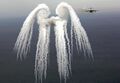 Wingtip vortices shown in flare smoke left behind a C-17 Globemaster III. Also known as smoke angels.
