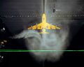 A Boeing 747 model has just passed through a stationary sheet of smoke, which is showing its trailing vortices, at the Vortex Facility at the Langley Research Center.