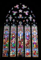 William Wailes. This window has the bright pastel colour, wealth of inventive ornament, and stereotypical gestures of windows by this firm. St Mary's, Chilham