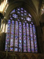 One of England's largest windows, the east window of Lincoln Cathedral, Ward and Nixon (1855), is a formal arrangement of small narrative scenes in roundels