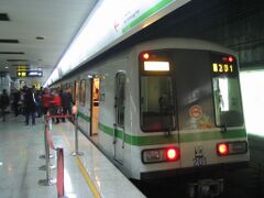 Shanghai Metro Line 2 train passes through People's Square station.