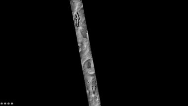 Schmidt (Martian crater), as seen by CTX camera (on Mars Reconnaissance Orbiter). Arrows indicate the north and south rims of crater.