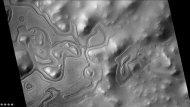 Layers just outside the rim of South crater in the form of "Swiss cheese", as seen by CTX camera (on Mars Reconnaissance Orbiter). Note: this is an enlargement of a previous image of east side of South crater.