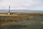 A view of the bay. Road and a radio tower in front.