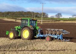 John Deere tractor ploughing (4251027220).jpg